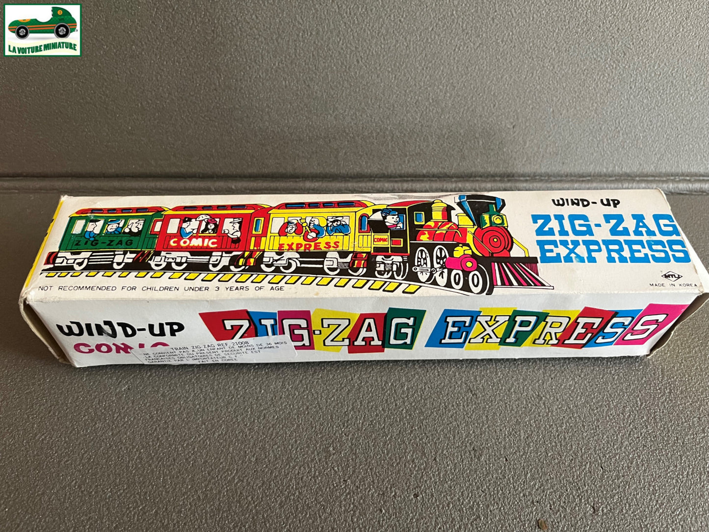 Ancien Jouet de Bazar Plastique Mécanisme Clé Train Zig Zag Express Comic Corée