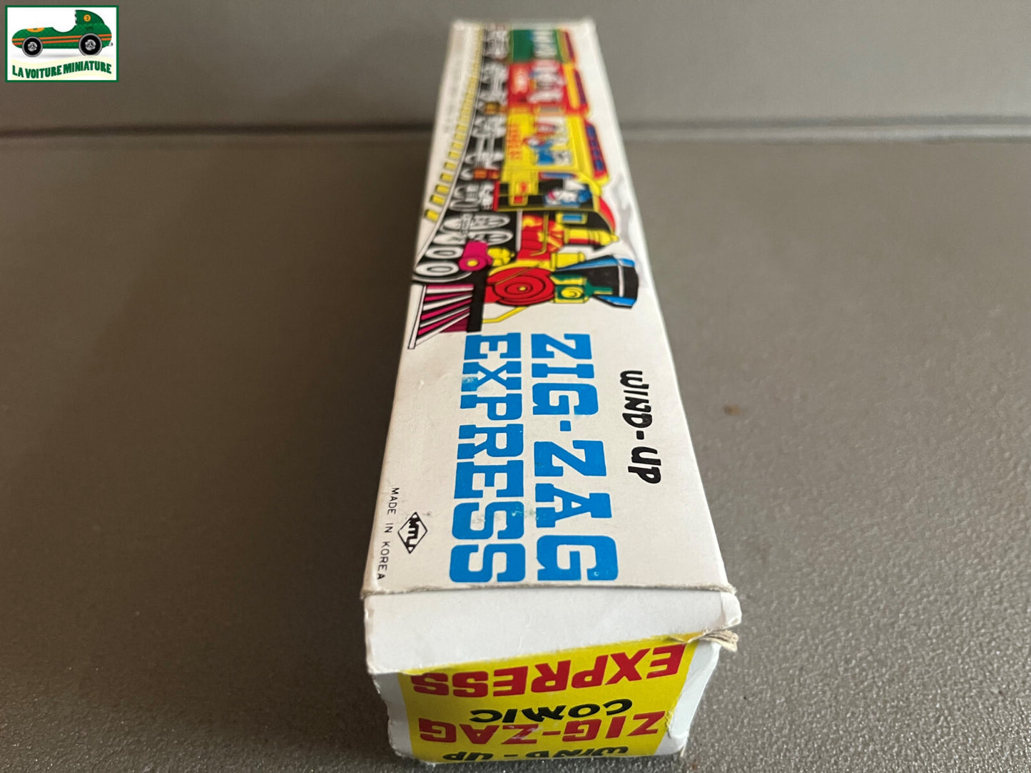 Ancien Jouet de Bazar Plastique Mécanisme Clé Train Zig Zag Express Comic Corée