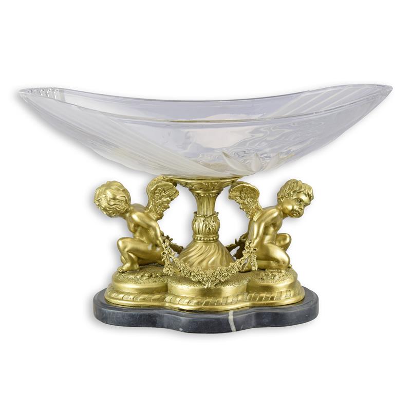 UN BOL EN VERRE MONTÉ SUR DU BRONZE