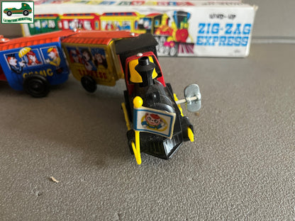 Ancien Jouet de Bazar Plastique Mécanisme Clé Train Zig Zag Express Comic Corée